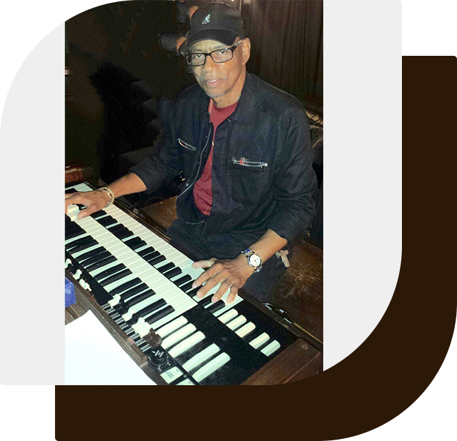 A man playing an instrument on the keyboard.